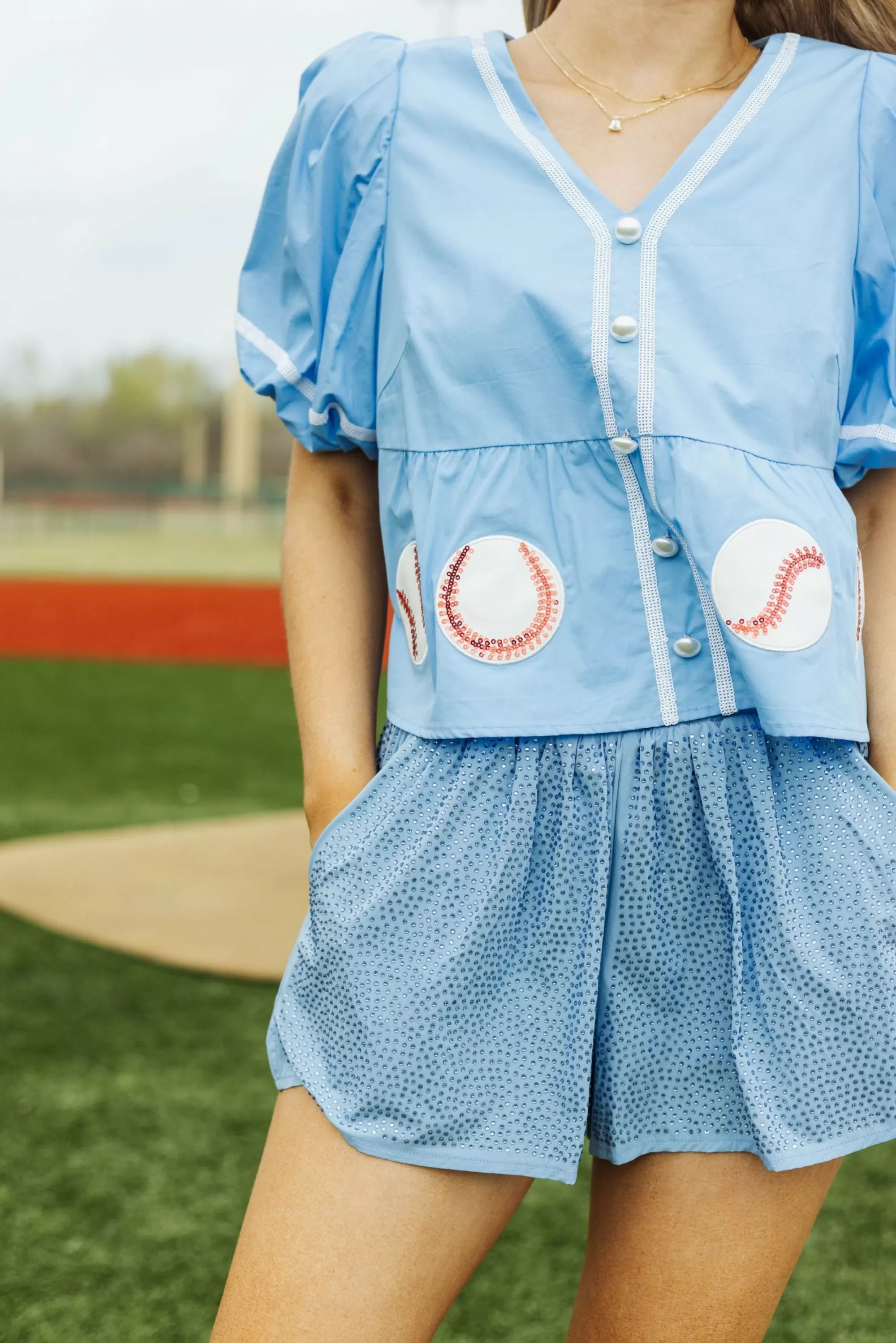 Queen Of Sparkles Peplum Baseball Top